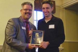 SPJ Colorado Pro chapter president Dennis Huspeni, left congratulates Pulitzer Prize-winning reporter Dave Philipps of The (Colorado Springs) Gazette, who received the Journalist of the Year award at the Top of the Rockies Awards presentation.