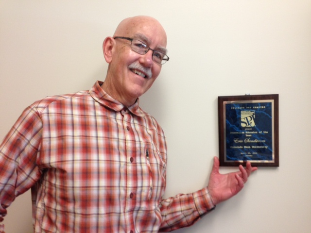 Colorado Mesa University journalism professor Eric Sandstrom is pictured in his office with the 2014 SPJ Colorado Pro Chapter Journalism Educator of the Year award he received in April. Sandstrom, adviser to the CMU student SPJ chapter and to the campus newspaper, hosted an SPJ visit on Oct. 6 at CMU.