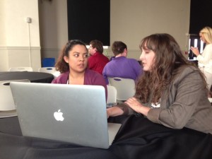 SPJ Utah Headliners Chapter president McKenzie Romero, right, reviews the resume of Michaela Funtanilla of Weber State University April 25 during the Region 9 Conference in Denver. 